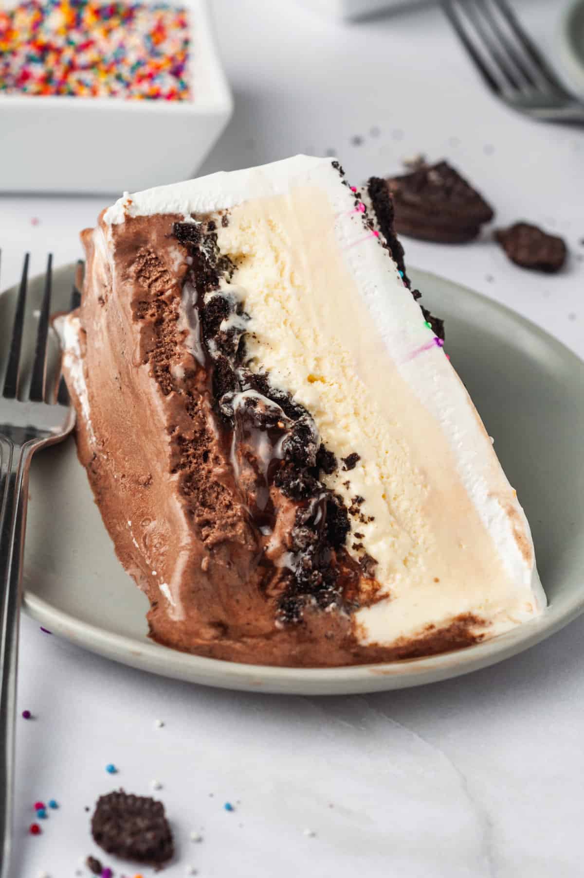slice of copycat dairy queen ice cream cake serve on a grey round plate