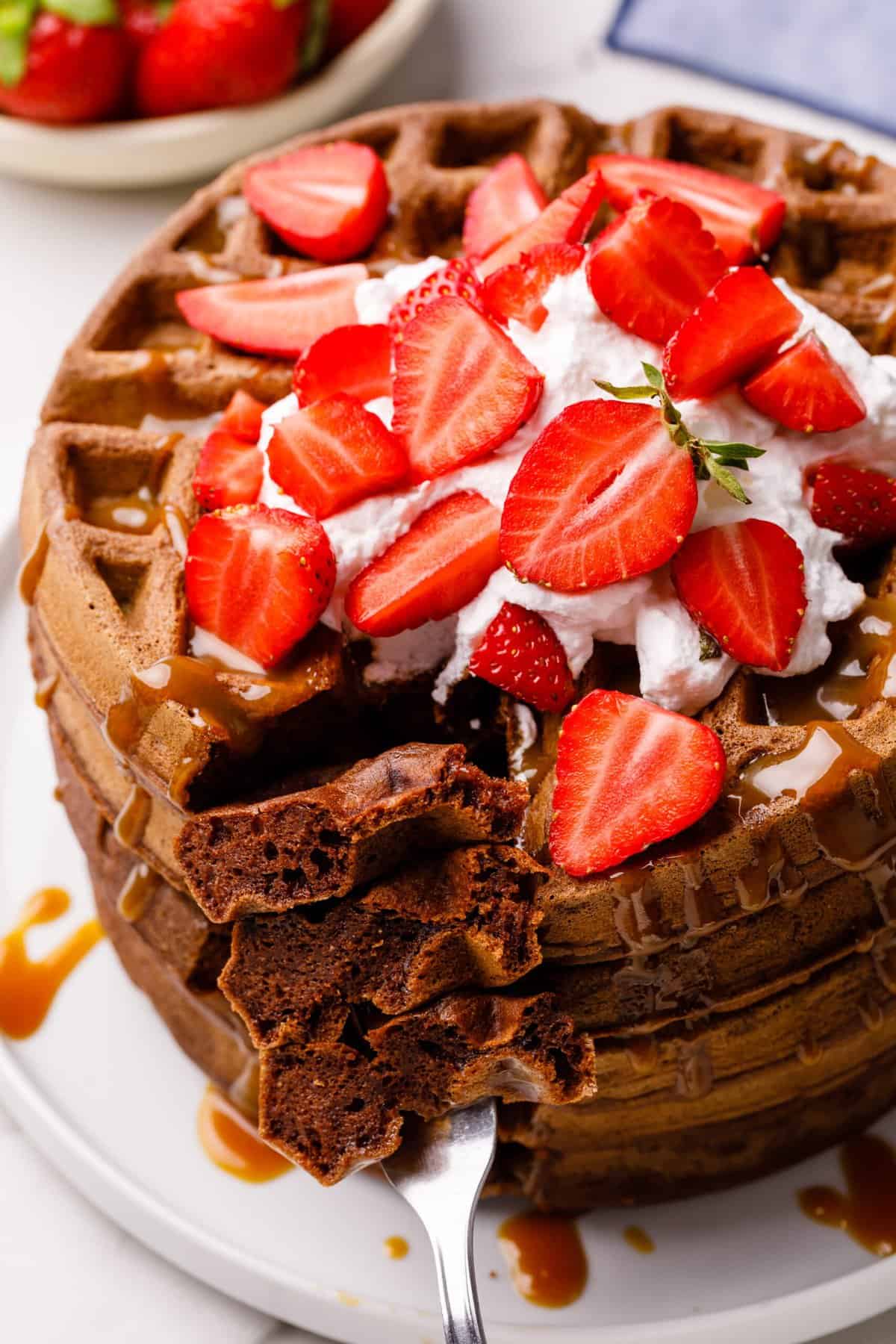 close up image of chocolate waffles on a fork
