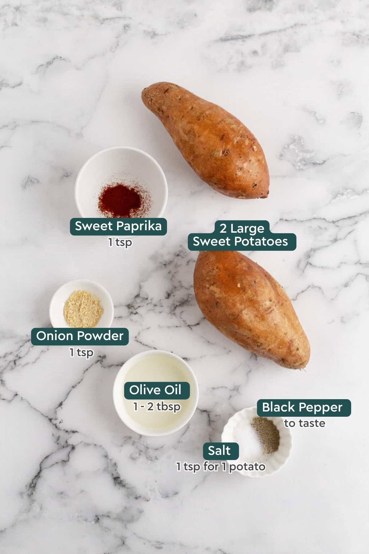 Ingredients for air fryer sweet potato fries, including sweet potatoes, paprika, onion powder, oil, black pepper, and salt.