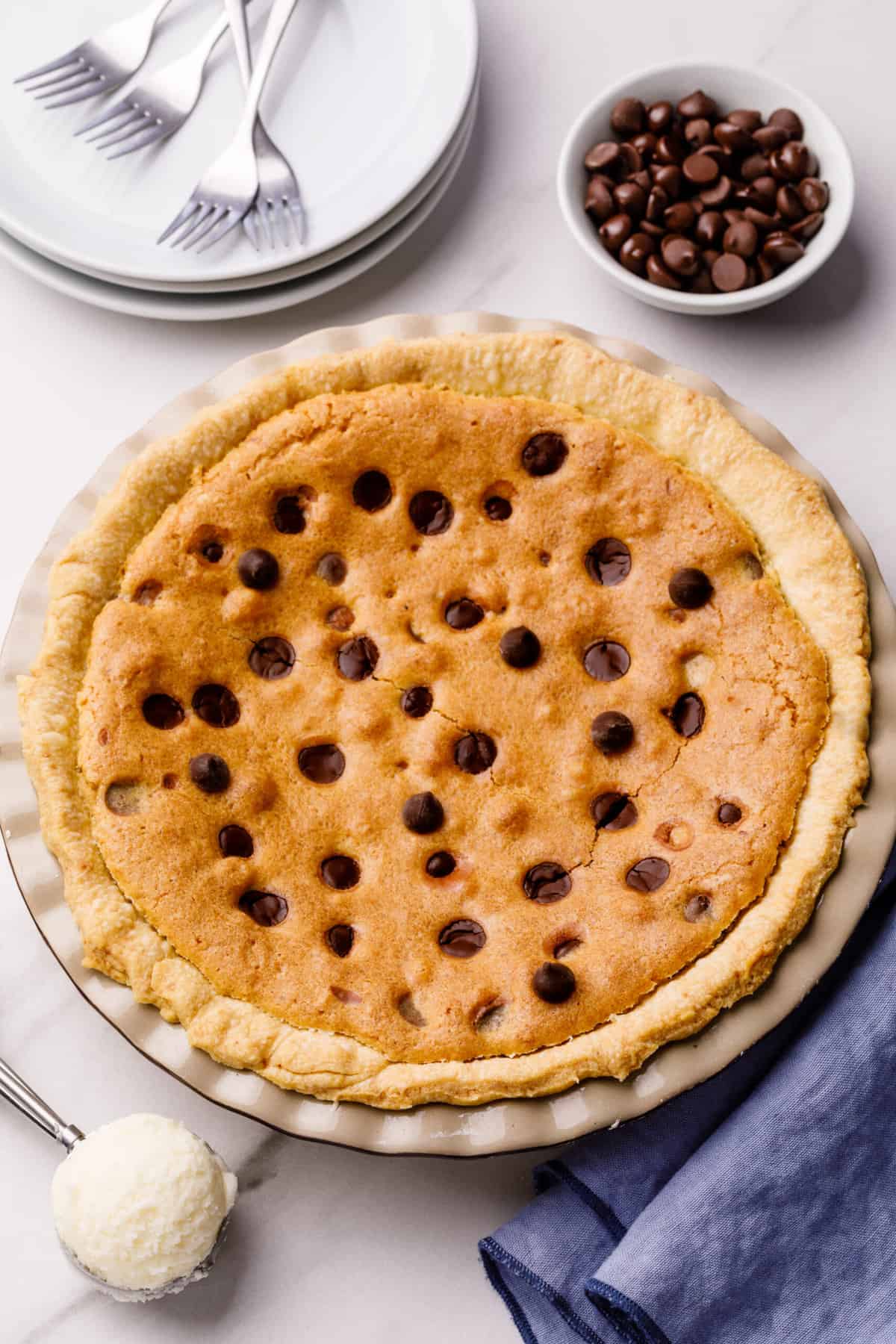 top down view of chocolate chip pie served in a pie dish