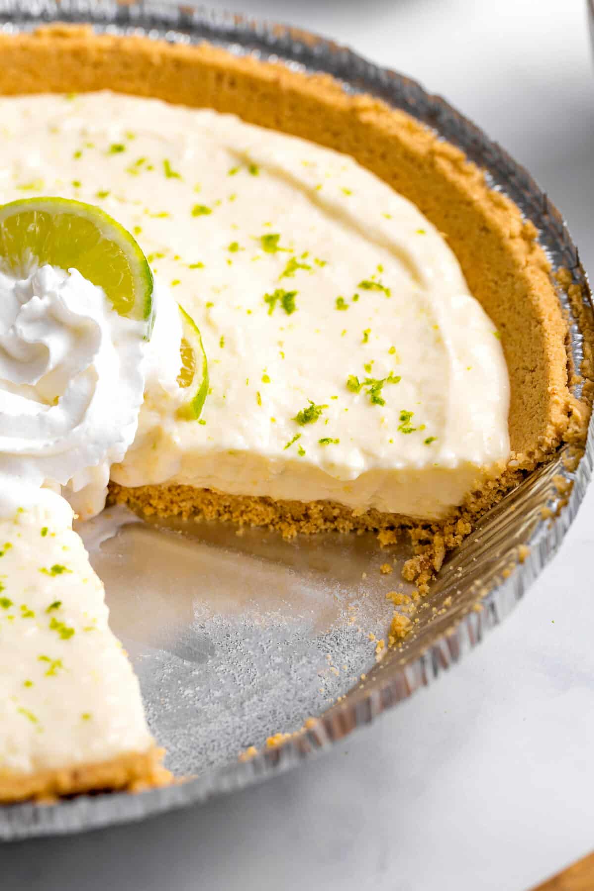 close up image showing the cross section of no bake key lime pie in a pie tin