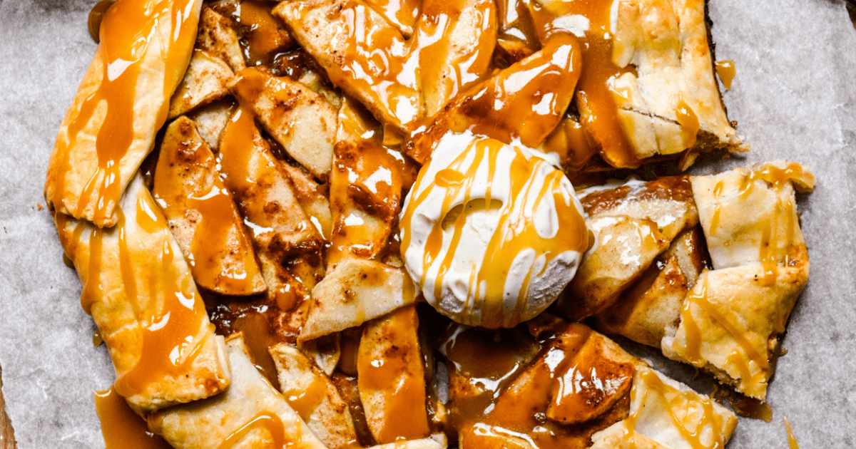 caramel apple tart topped with scoop of ice cream