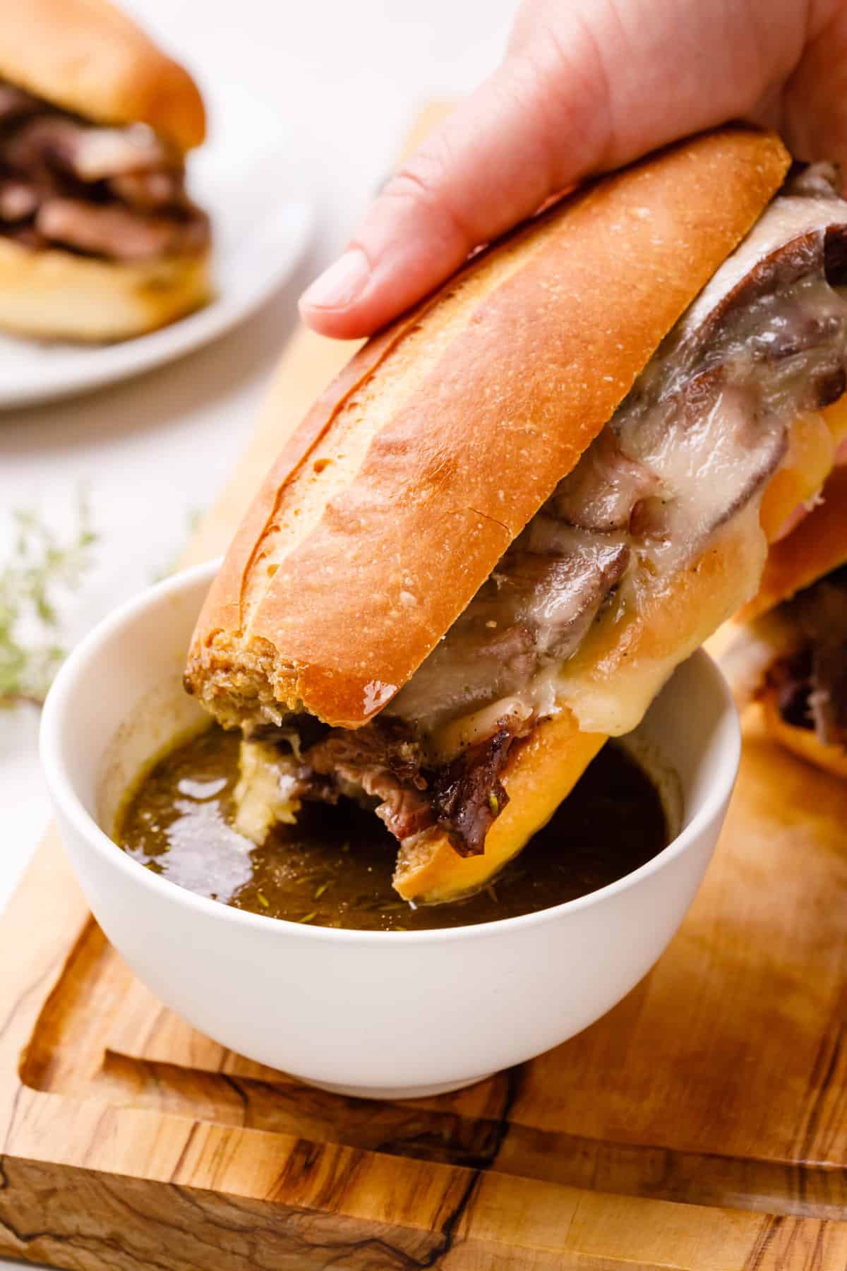 french dip sandwich dipped in jus