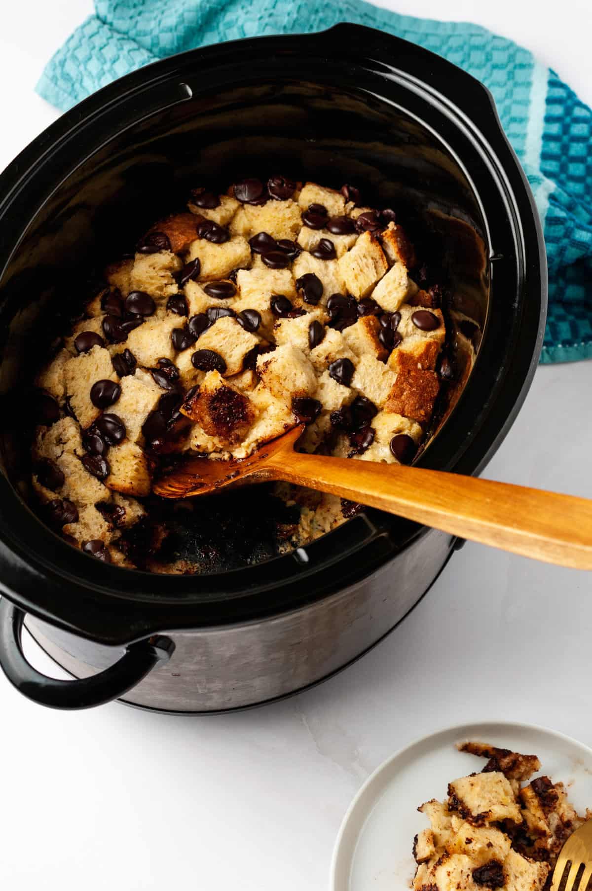 top down image of chocolate chip bread pudding cooked in a slow cooker 