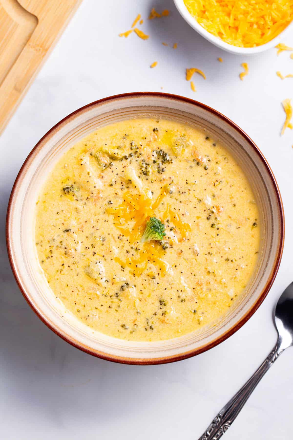 top down image of a bowl of broccoli cheddar soup
