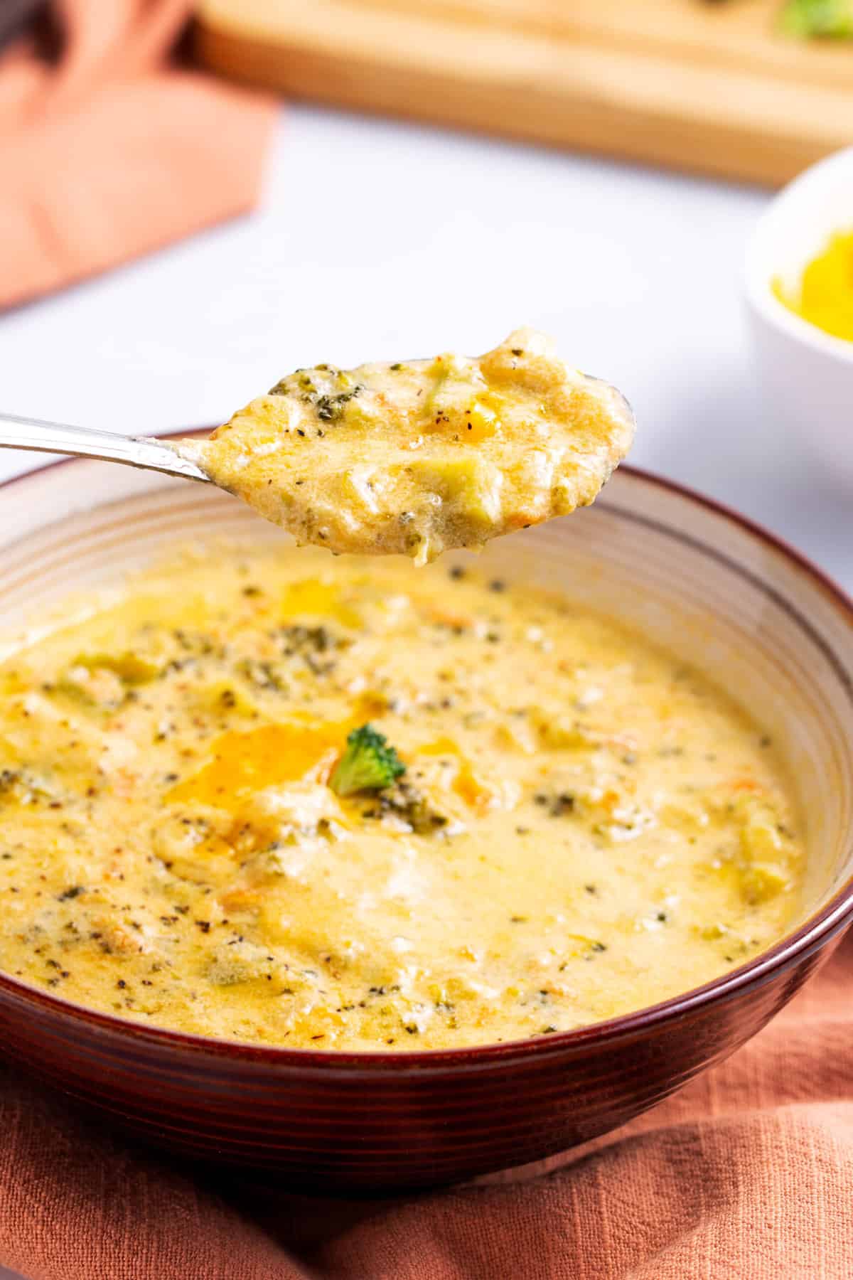 bowl and spoonful of broccoli cheddar soup