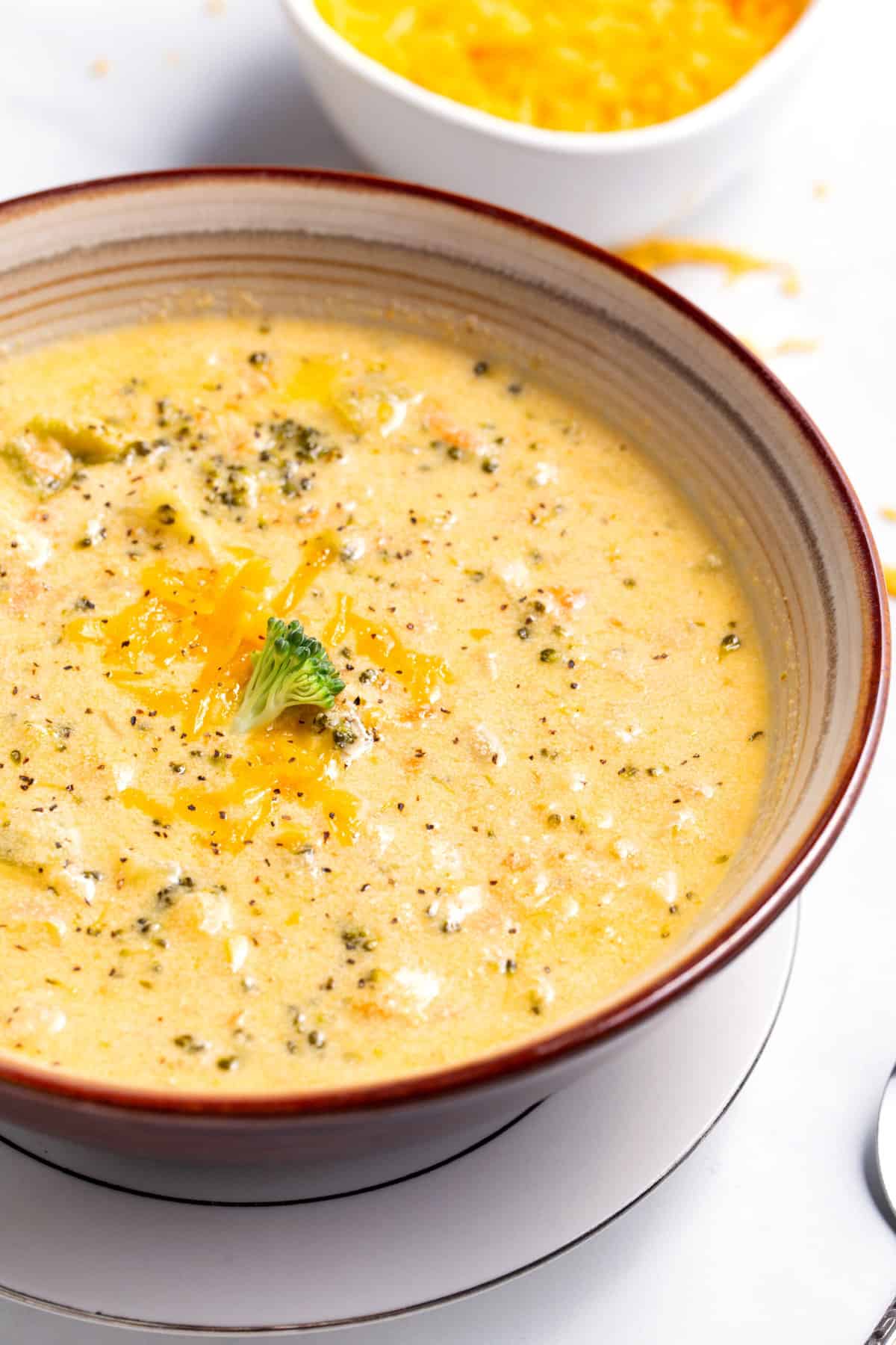 close up image of a bowl of broccoli cheddar soup