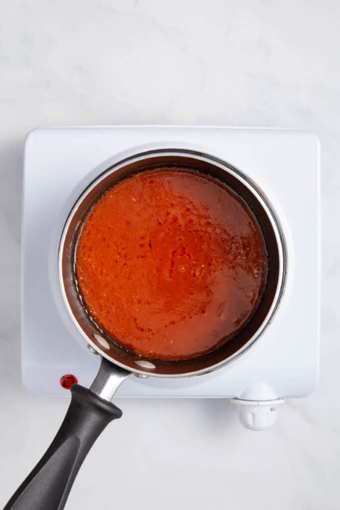 Buffalo sauce in pan.
