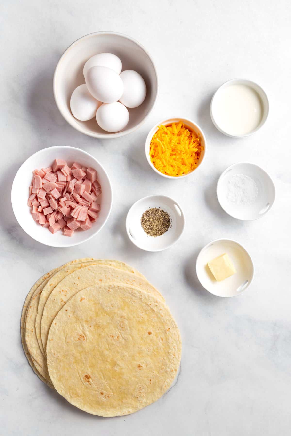 ingredients to make ham and cheese burritos.