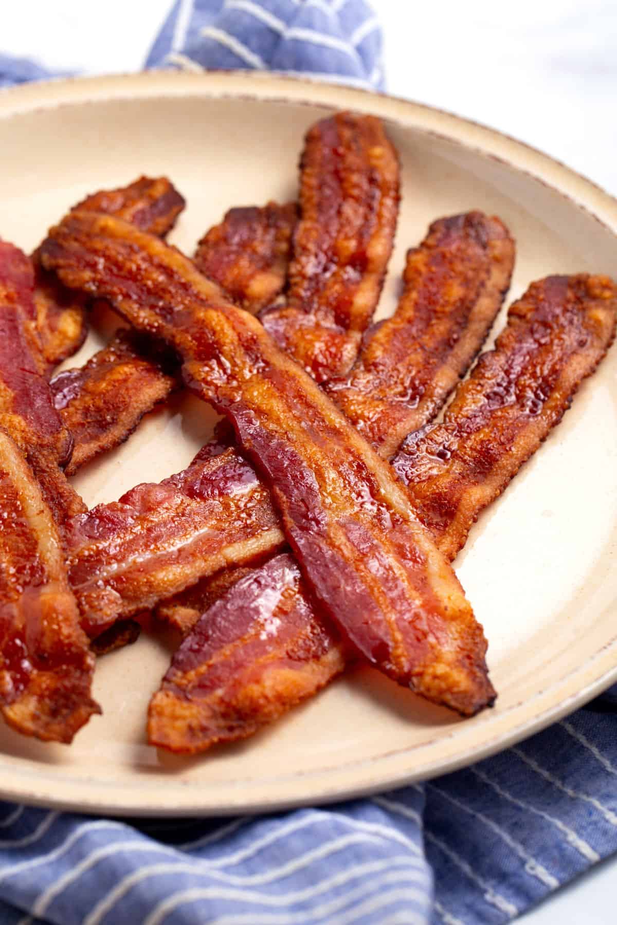 close up image of baked bacon on a plate
