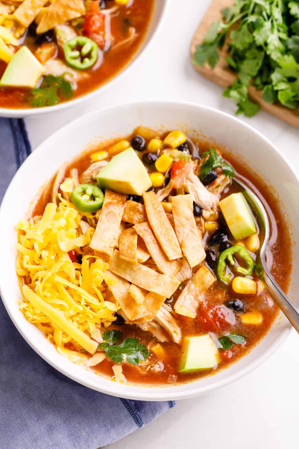 close up image of a bowl of chicken tortilla soup