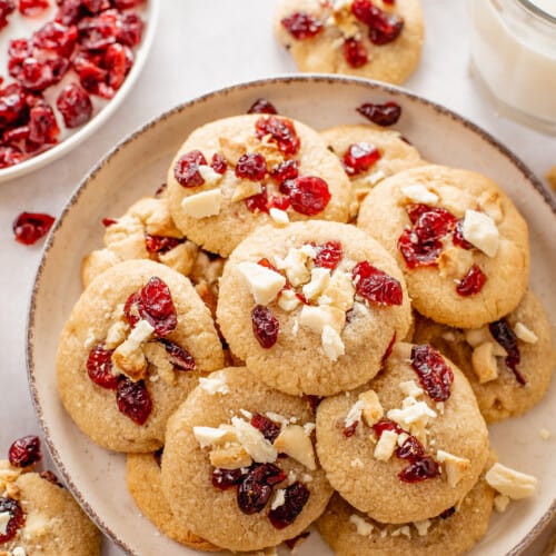 A plate of cranberry white chocolate chunk cookies.