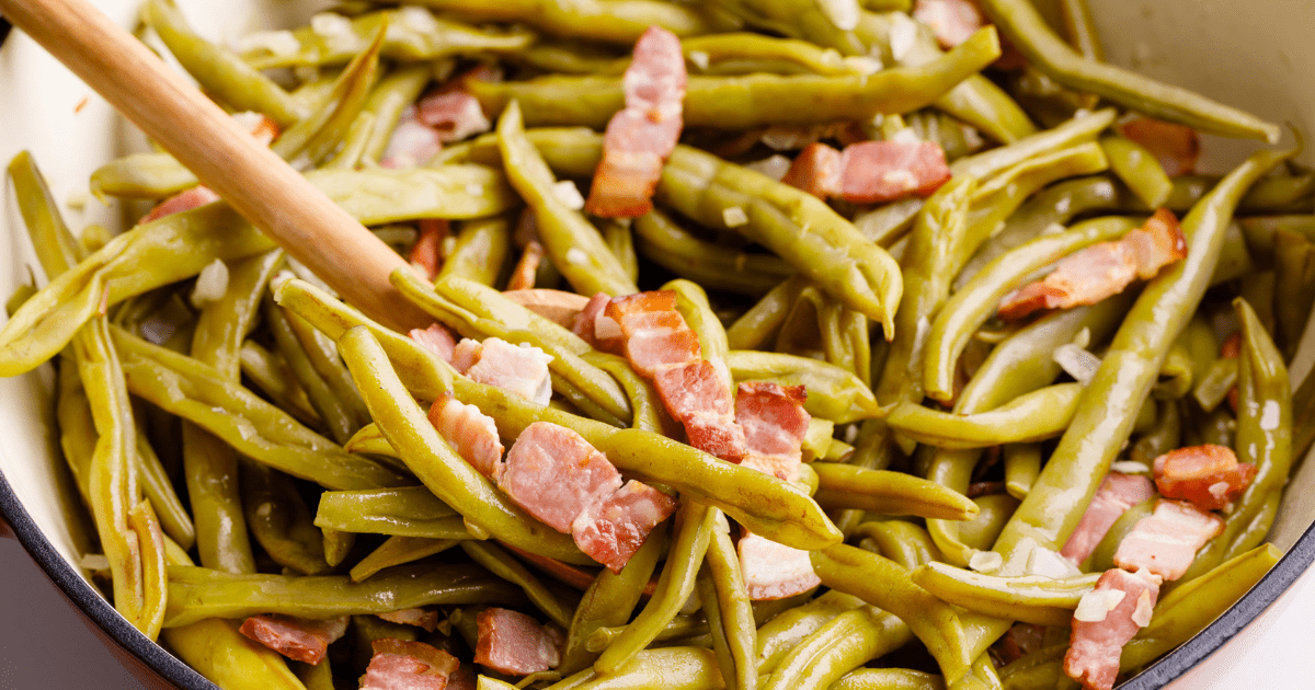 A pot of southern green beans with bacon. 