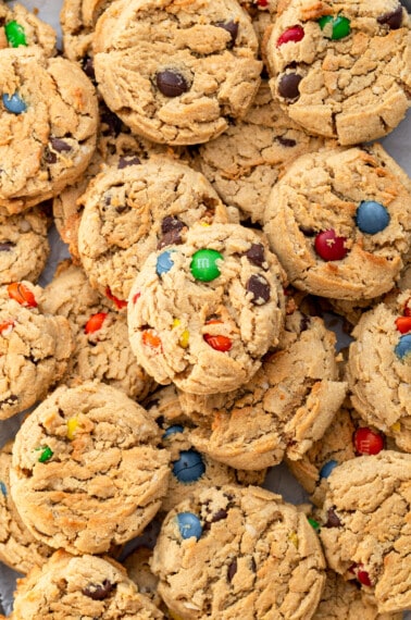 Close up image of overlapping monster cookies.