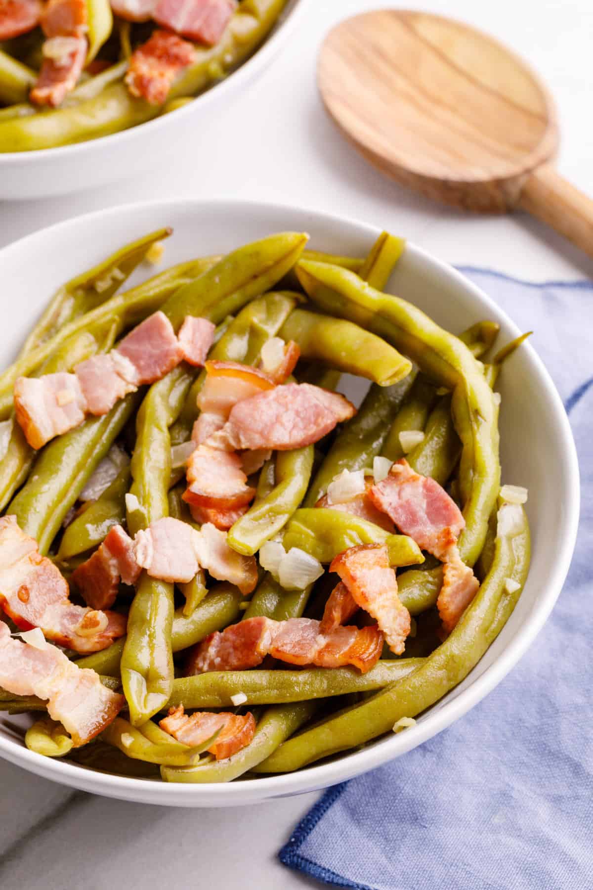 southern style green beans served in a white round bowl