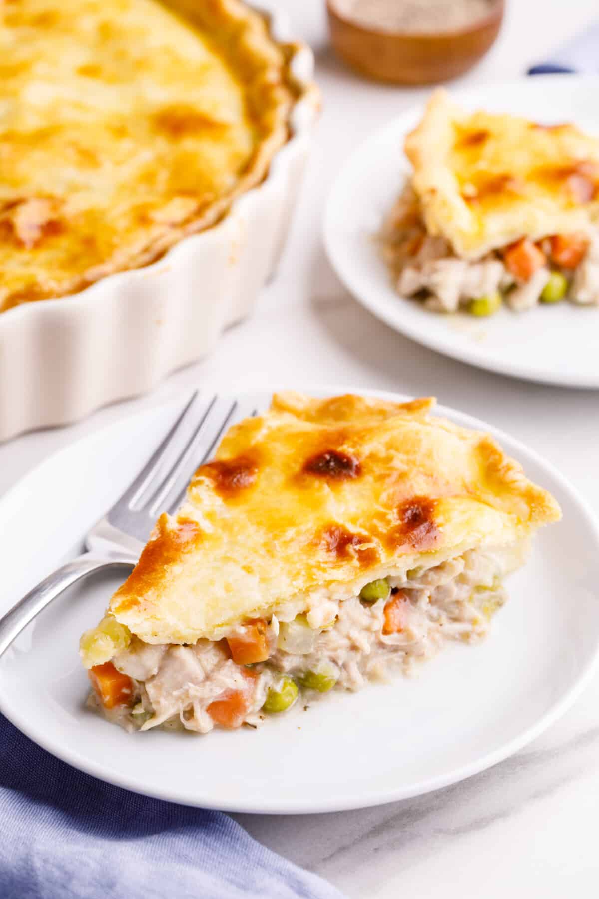 A slice of turkey pot pie on a plate.
