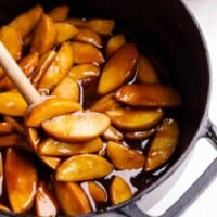 Overhead image of apple pie filling being stirred.