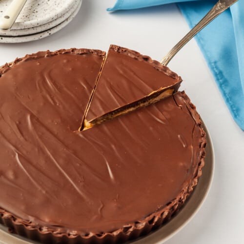 Reese's peanut butter cup pie with a slice being lifted.
