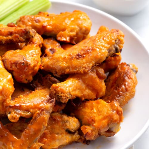 A plate of baked buffalo chicken wings.