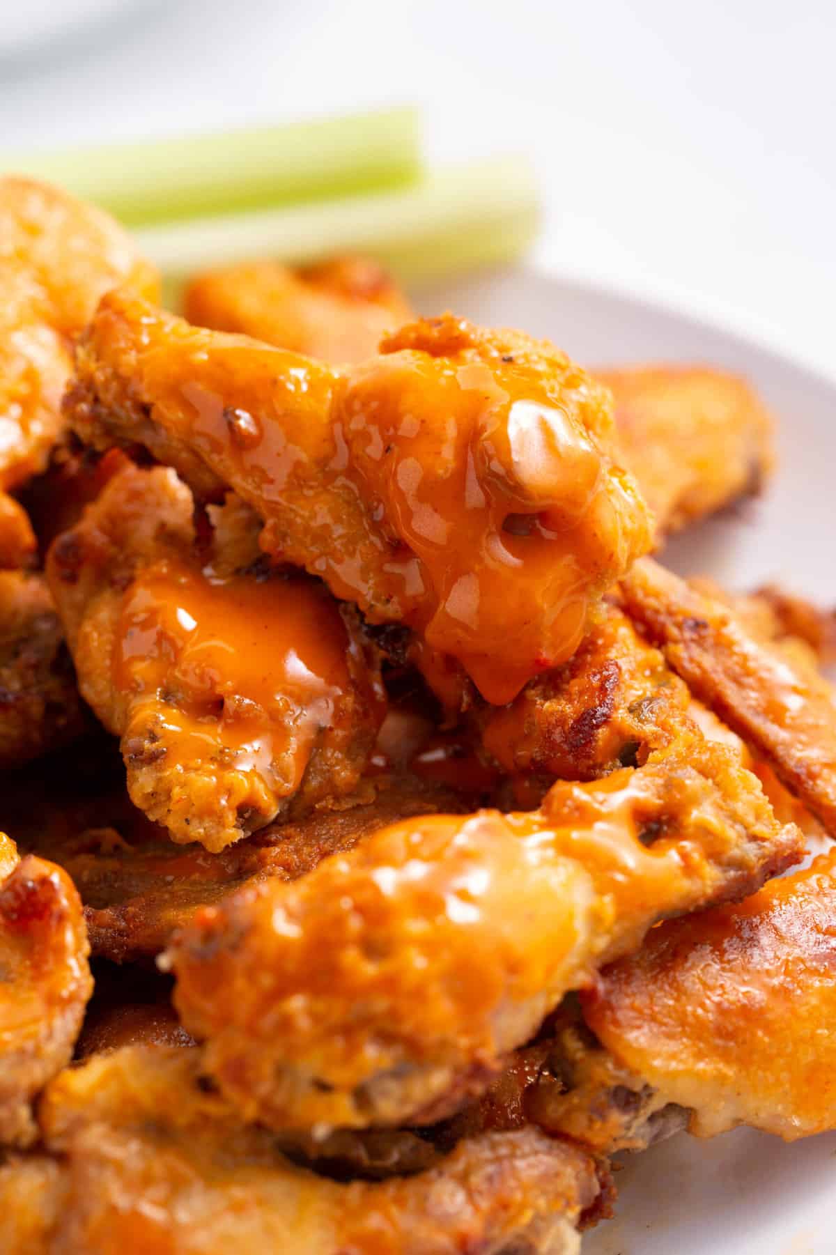 close up image of a pile of baked buffalo wings