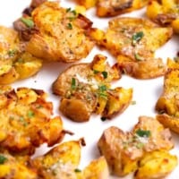 crispy smashed potatoes on a plate.