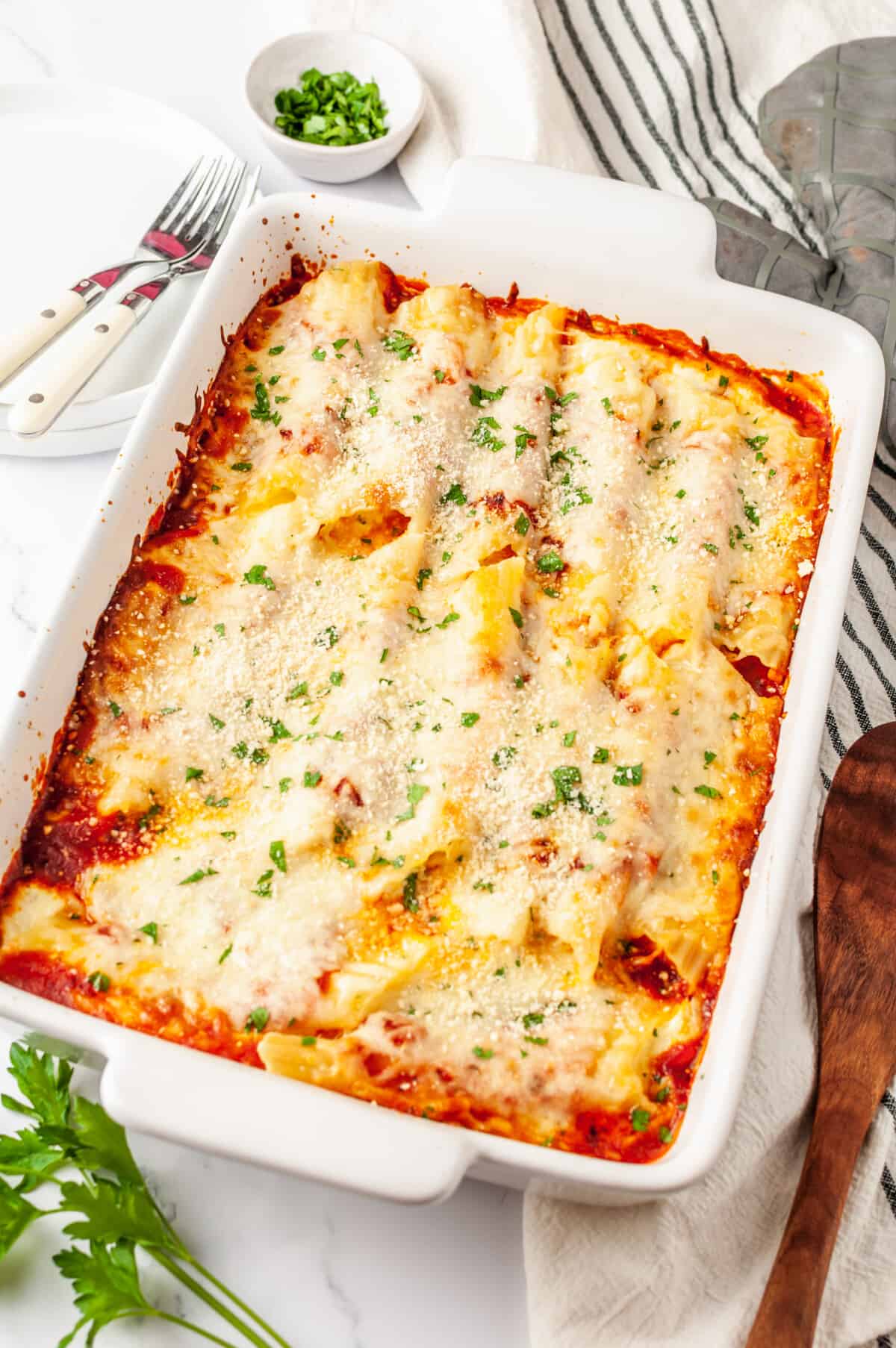 Cheese manicotti in a baking dish.