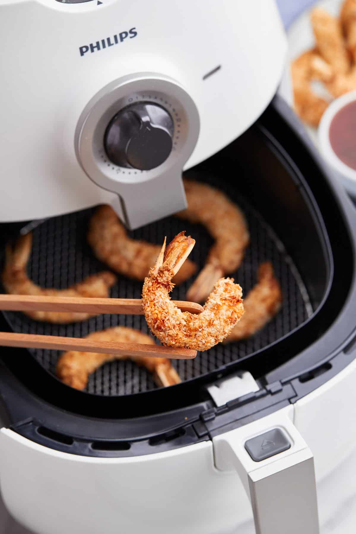 close up image of a crispy coconut shrimp made in the air fryer