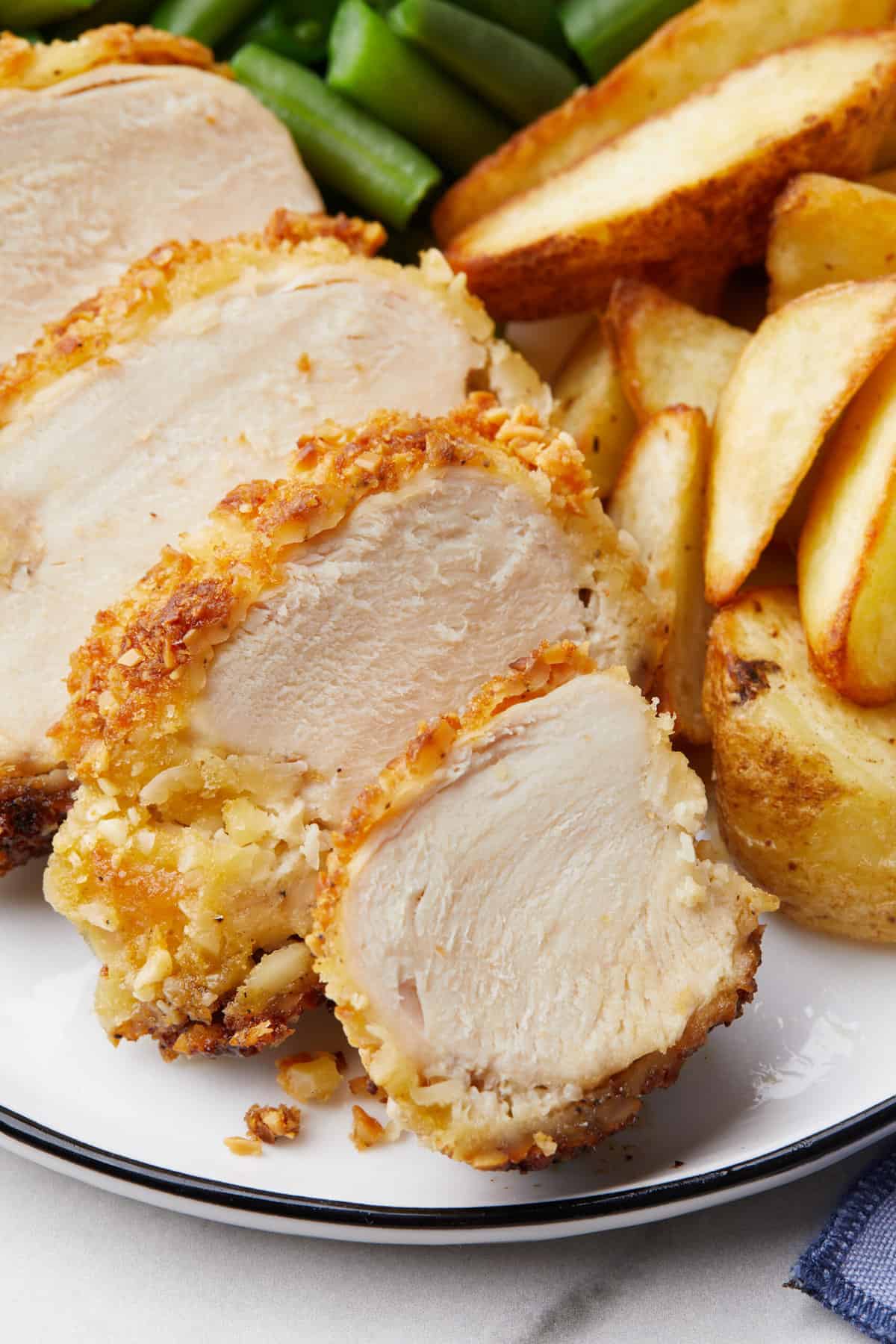 close up image of sliced crispy almond chicken breast