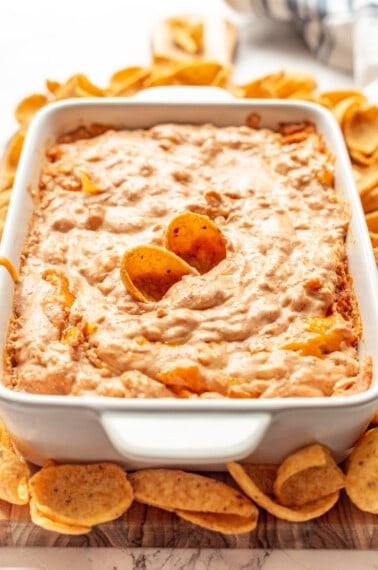 Refried bean dip with chips sticking out.