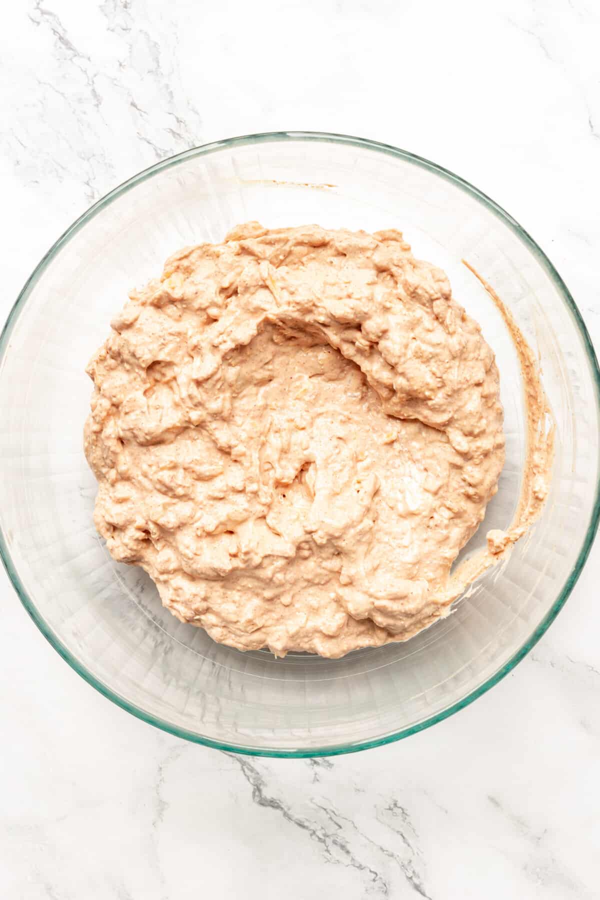 Homemade bean dip in glass bowl.