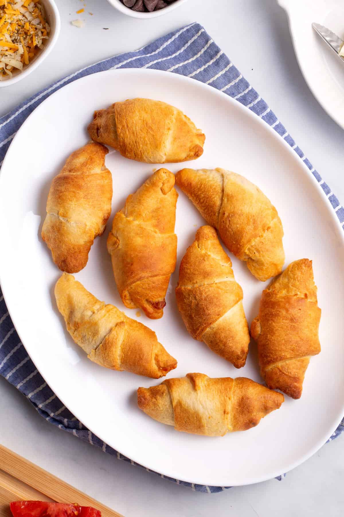 top down image of an oval plate of air fryer crescent rolls