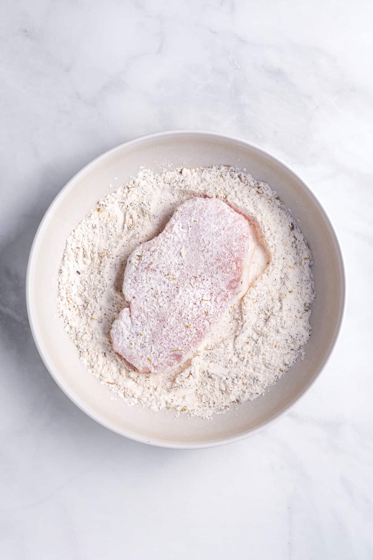 step 1 to make baked breaded pork chops.