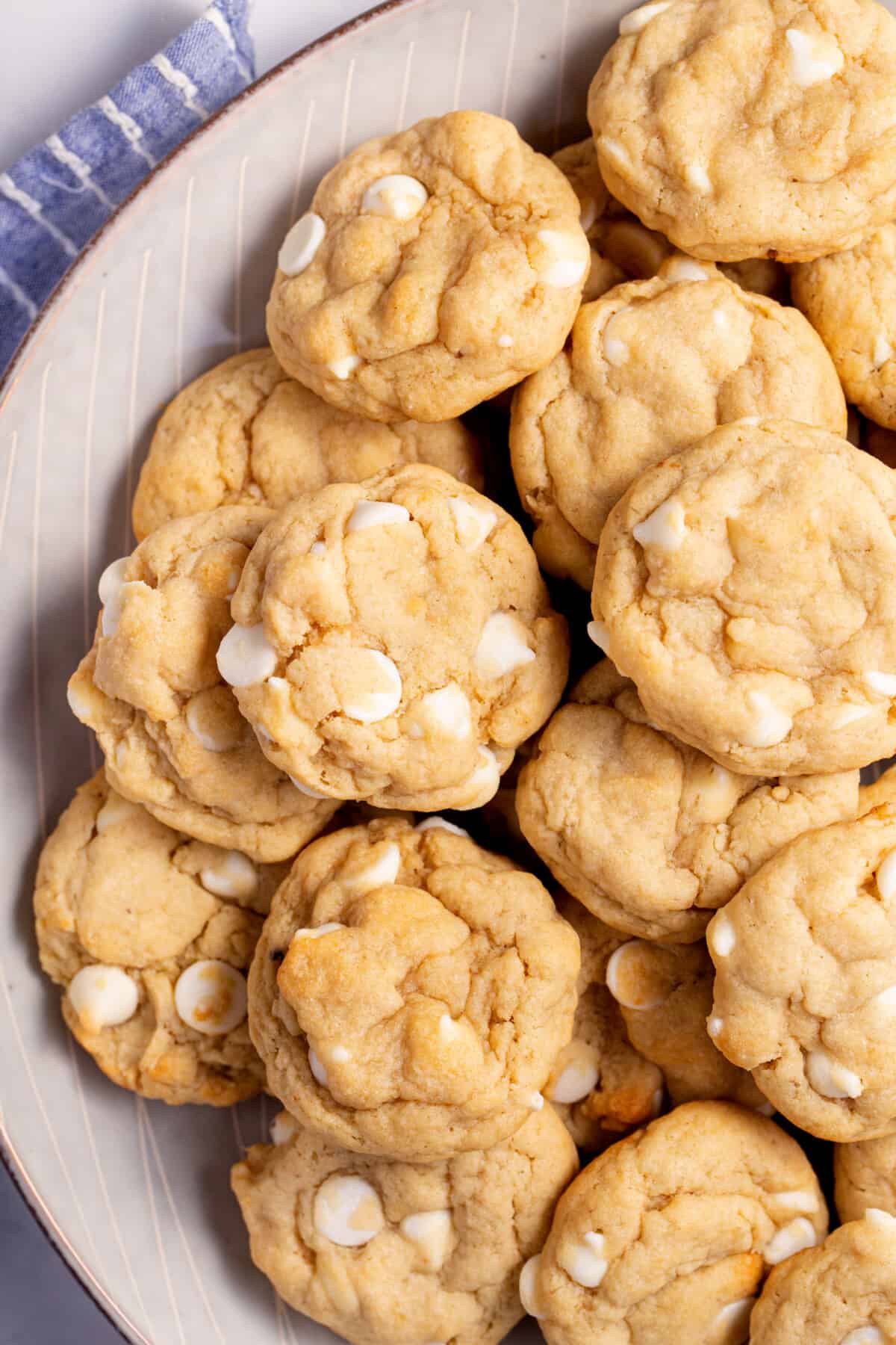 A plate of white chocolate chip banana pudding cookies.