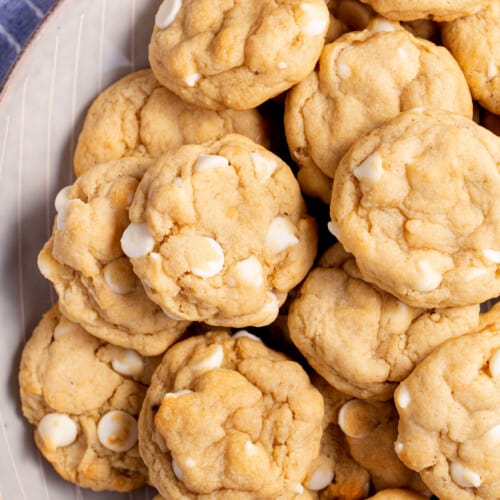 A plate of white chocolate chip banana pudding cookies.