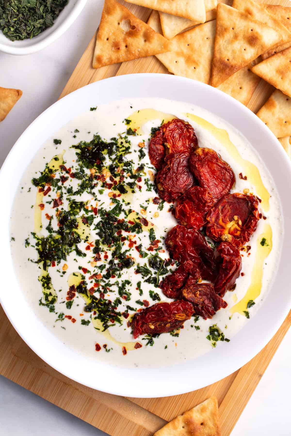 top down image of whipped feta dip served in a large round bowl