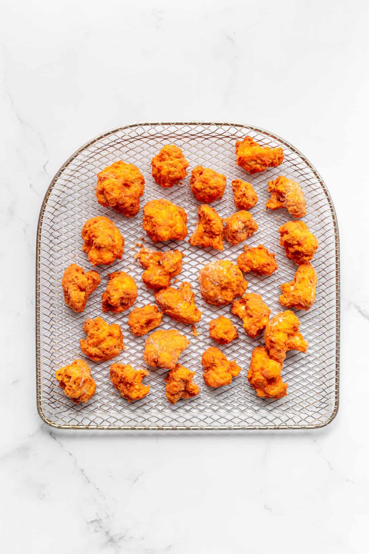 step 4 to make air fried buffalo cauliflower.