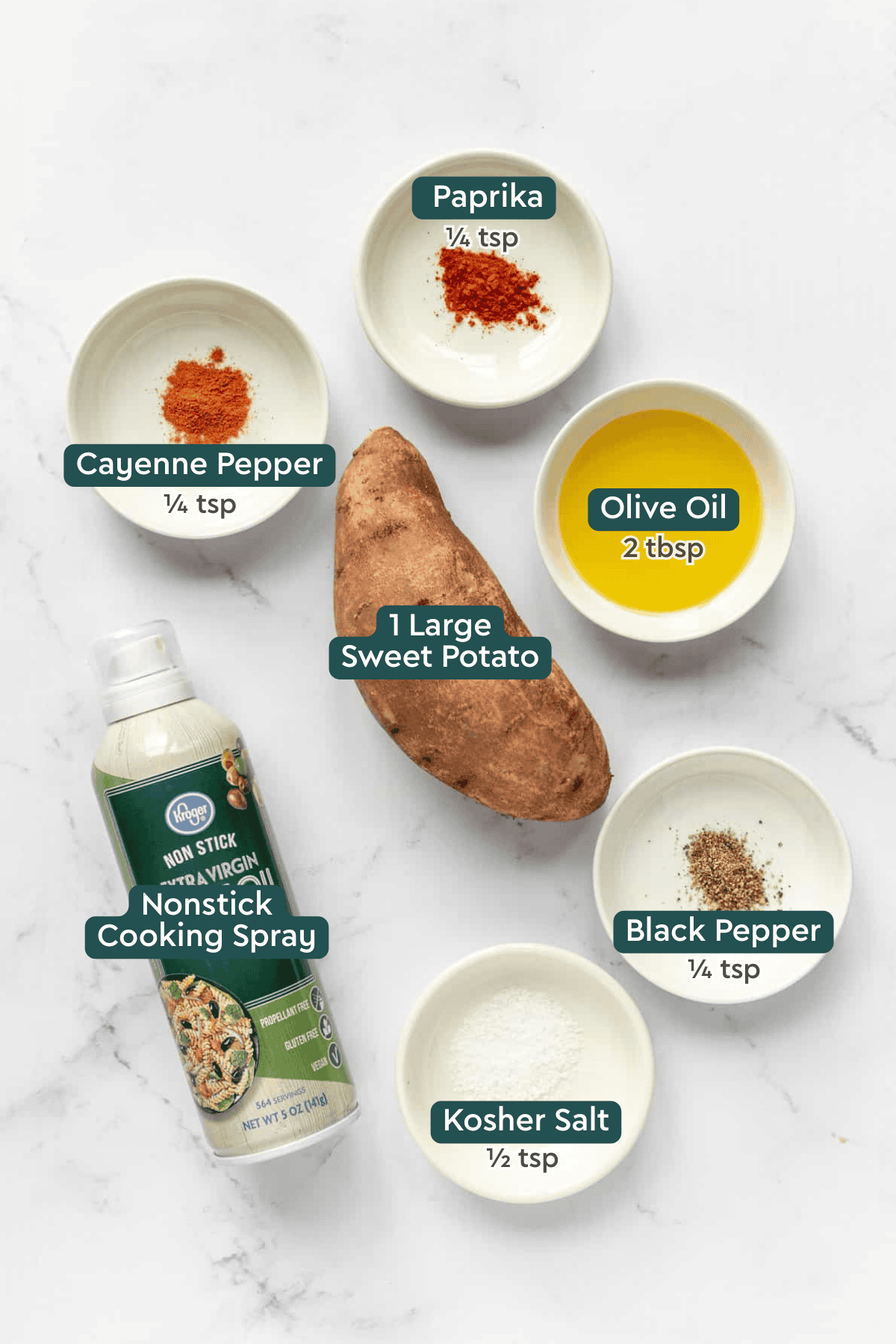 All of the ingredients for air fryer sweet potato chips in bowls on a white countertop.