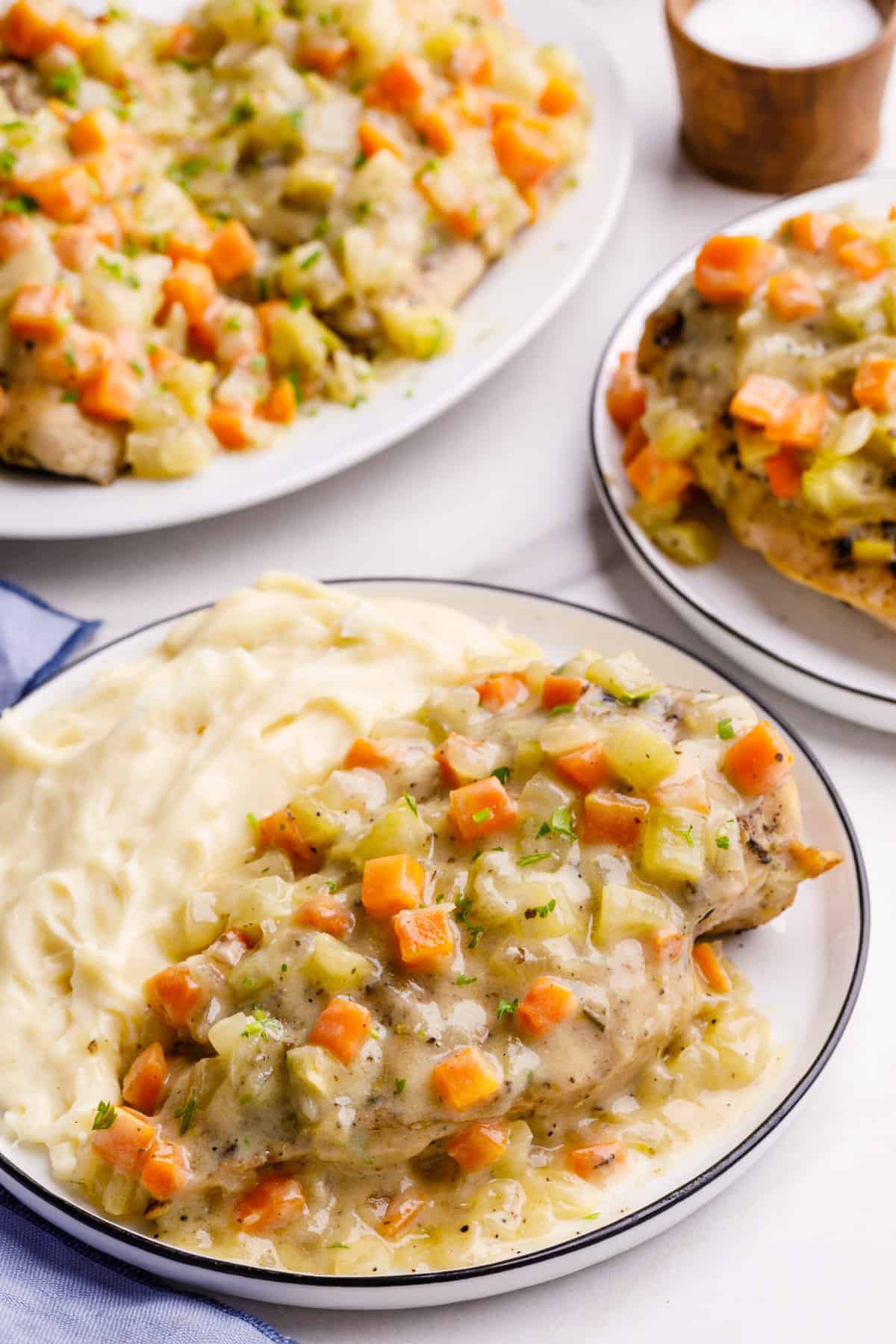 close up image of a plate of dutch oven chicken breast with a side of mashed potatoes