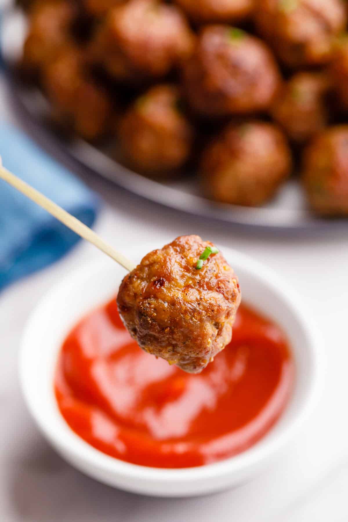 close up of a air fryer meatball on a toothpick