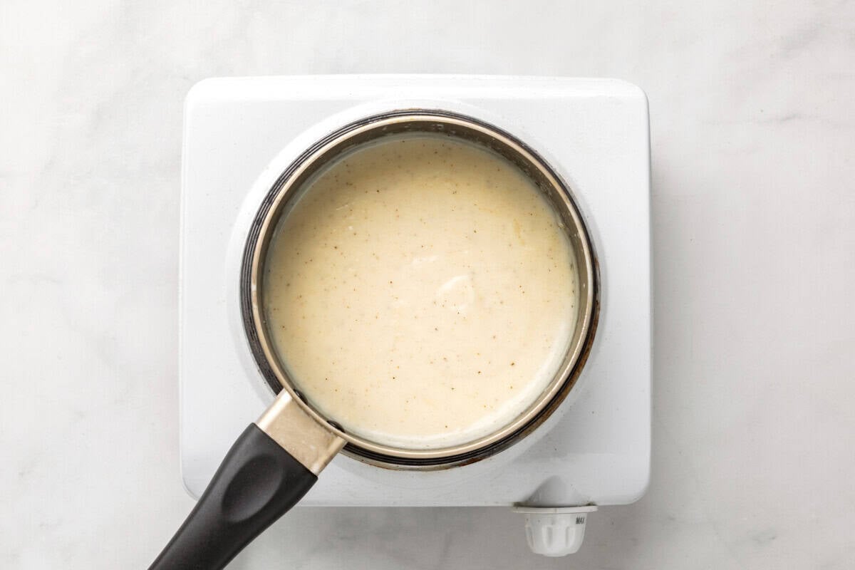 White gravy in saucepan.