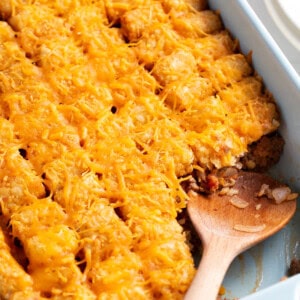 Cheeseburger tater tot casserole with a serving missing.