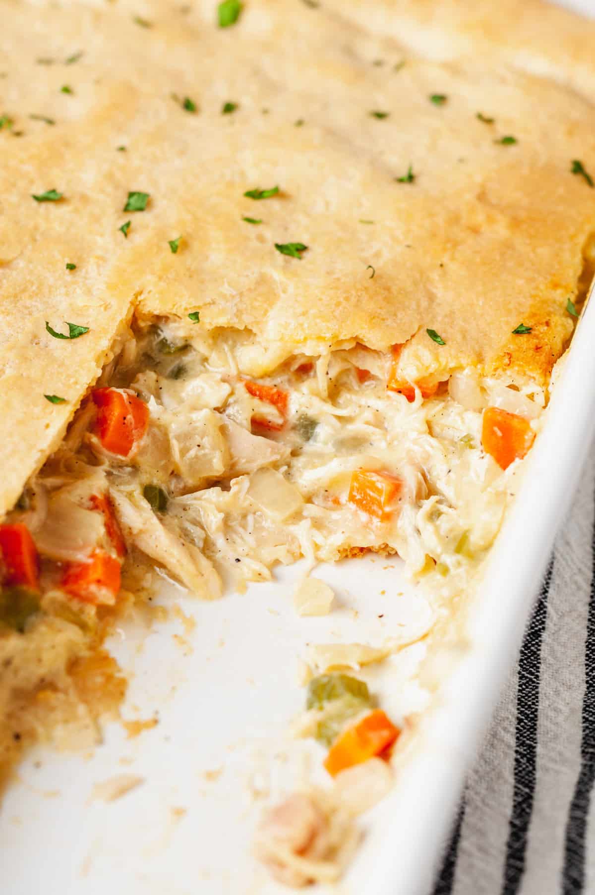 close up image of the cross section of the chicken pot pie crescent roll bake