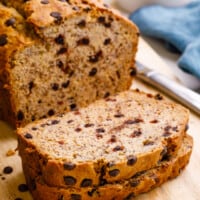 A cake mix banana bread loaf with two pieces sliced.