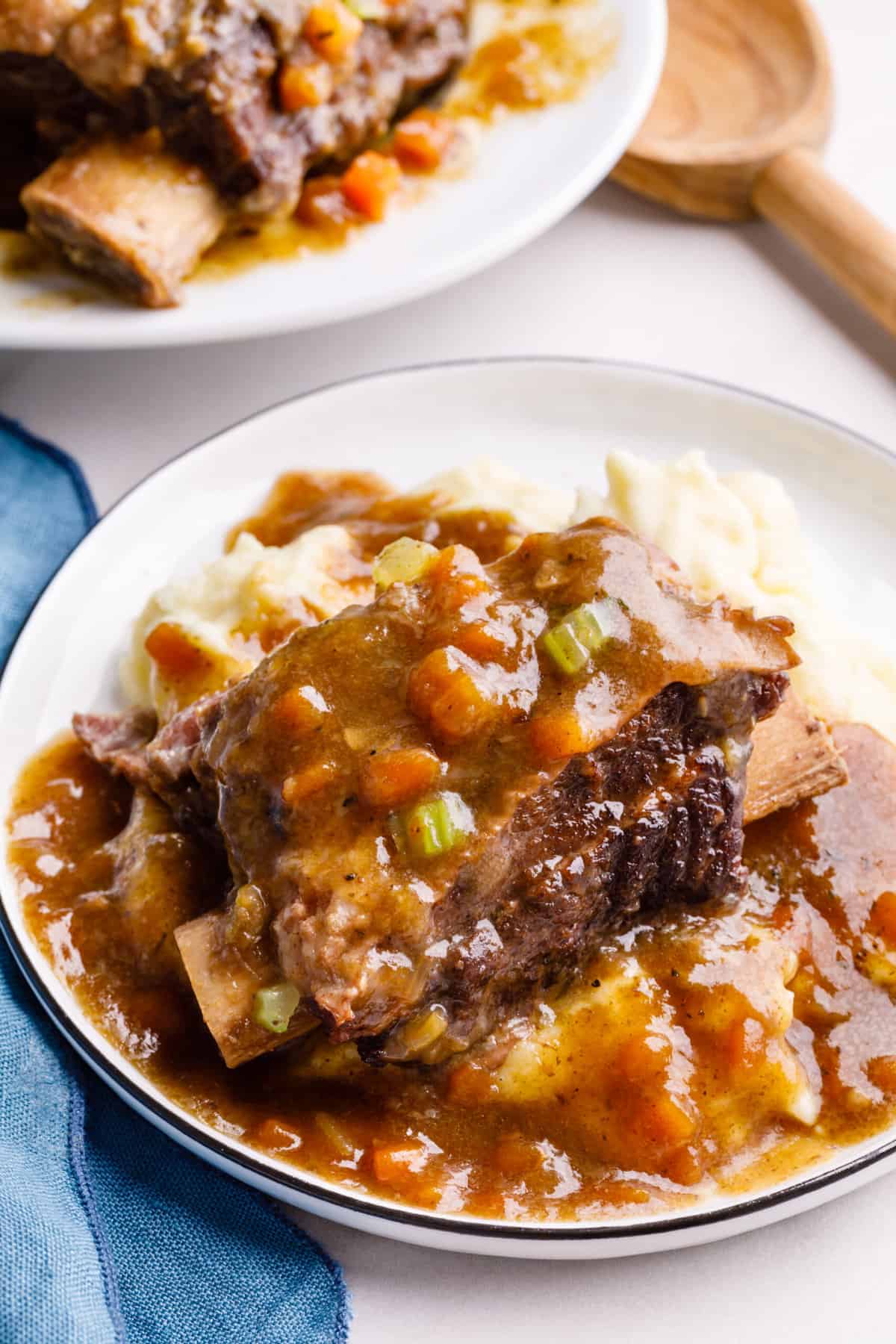 close up image of a plate of mashed potatoes, instant pot short ribs and gravy