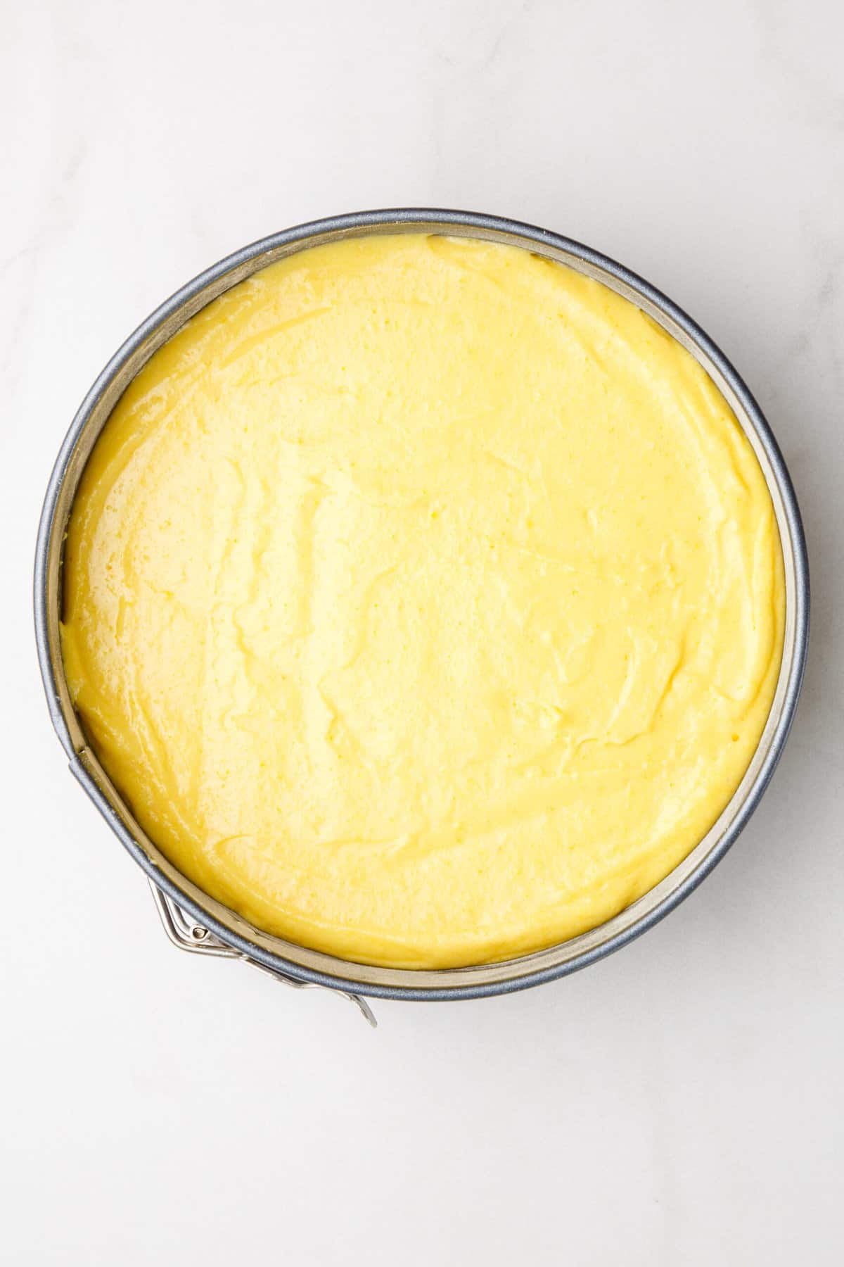 step 4 to make orange cake, pour the batter into an 8-inch springform pan