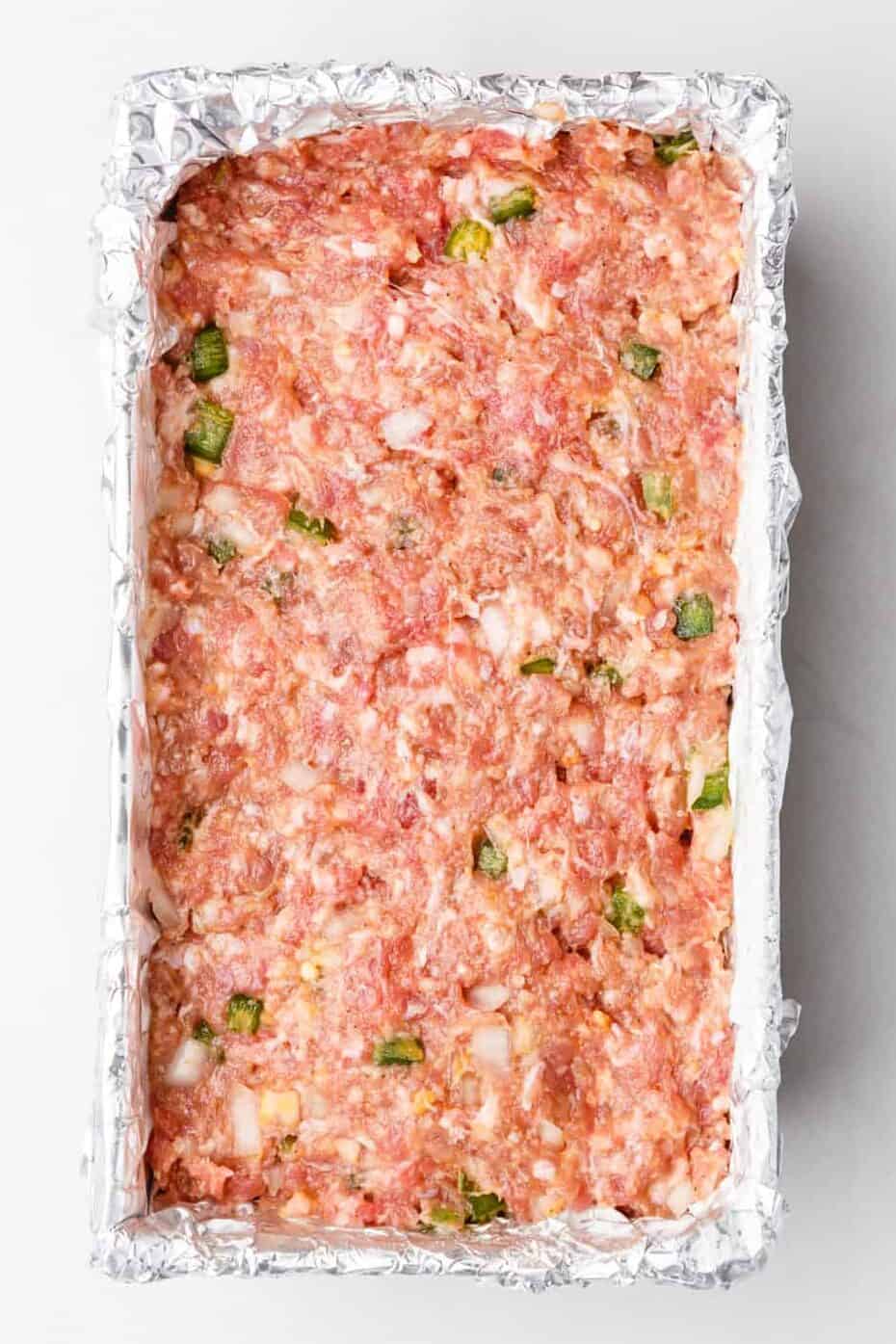 step 3 to make southern meatloaf, spread meat mixture in a foil-lined 9-inch loaf shaped baking pan