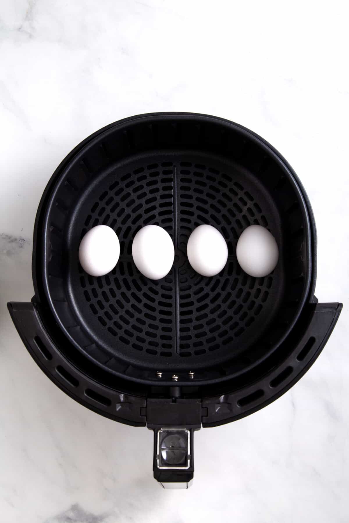 step 1 to make hard boiled or soft boiled eggs in an air fryer.