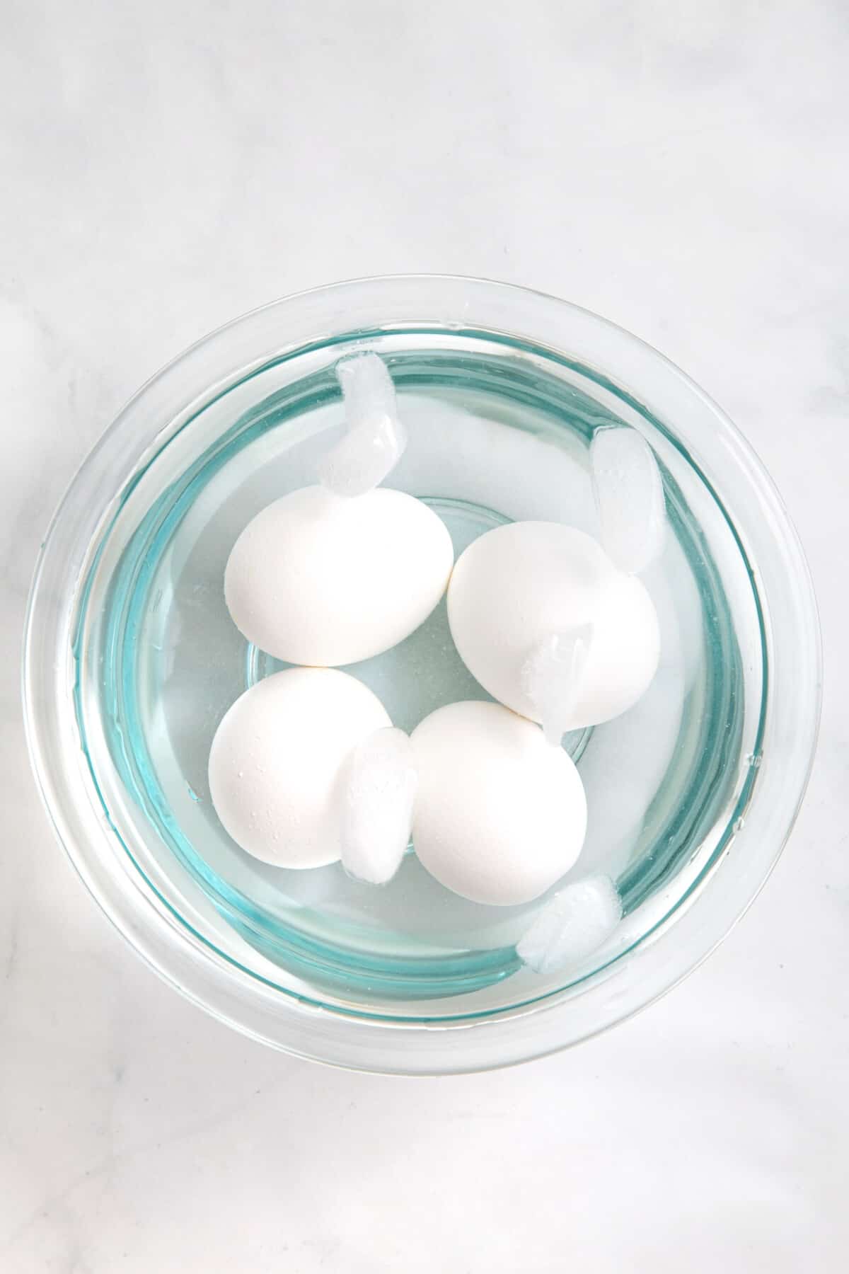 step 2 to make air fryer eggs, put eggs in an ice bath.