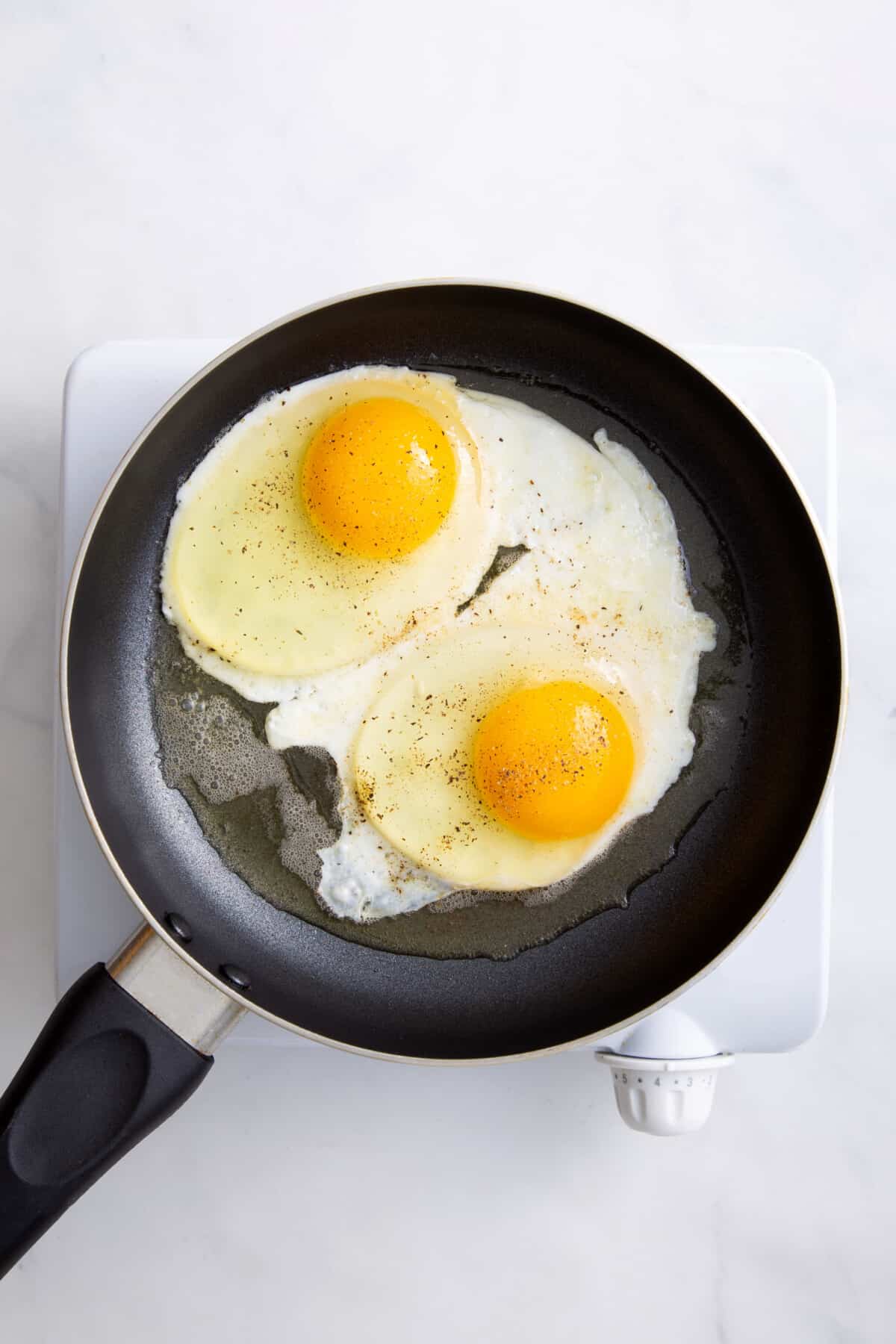 step 2 to make basted eggs, add water to the pan with the partly cooked eggs.