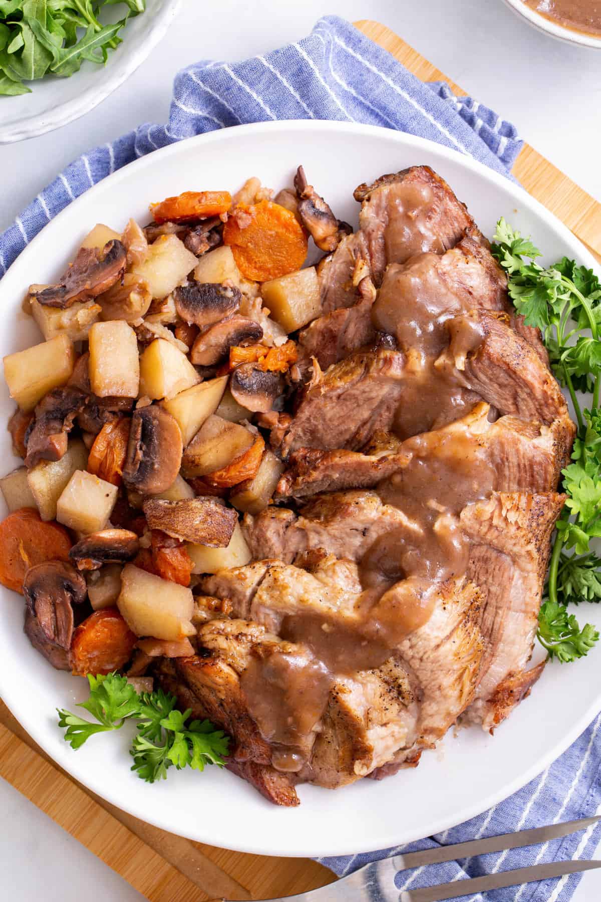 top down image of instant pot pork roast served on a large oval plate